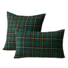 A set of two dark green and plaid tartan decorative throw pillow covers.