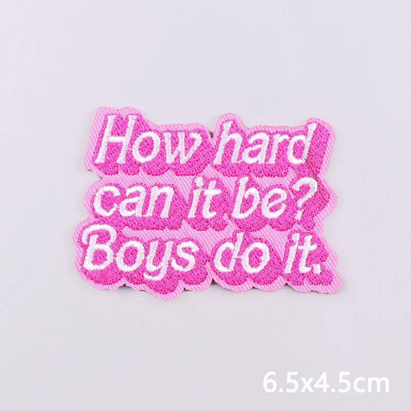 Pink embroidered patch with text asking How hard can it be Boys do it.