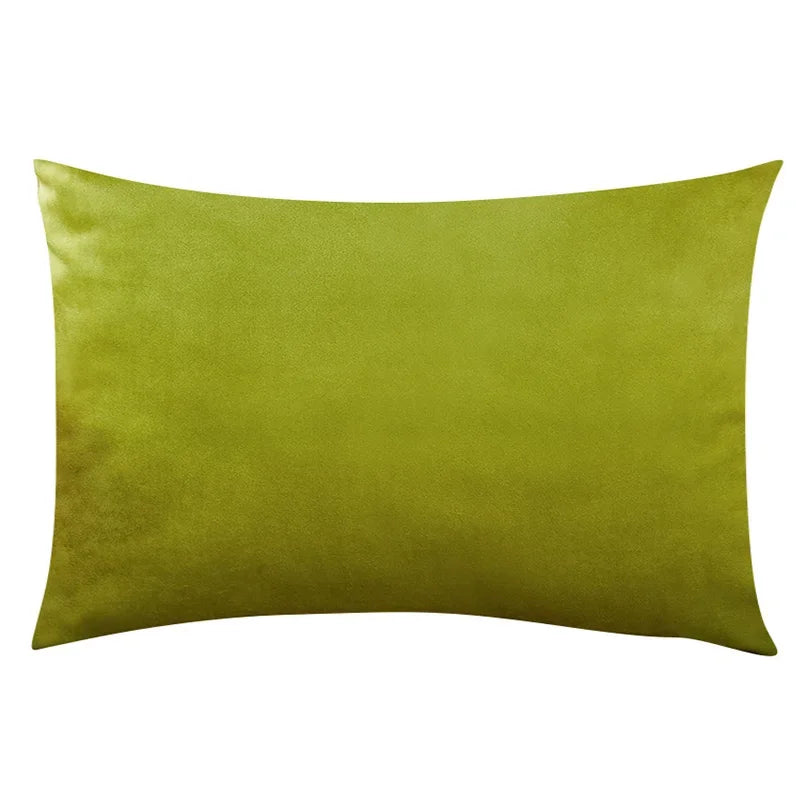 A square velvet throw pillow cover in olive green or chartreuse color.