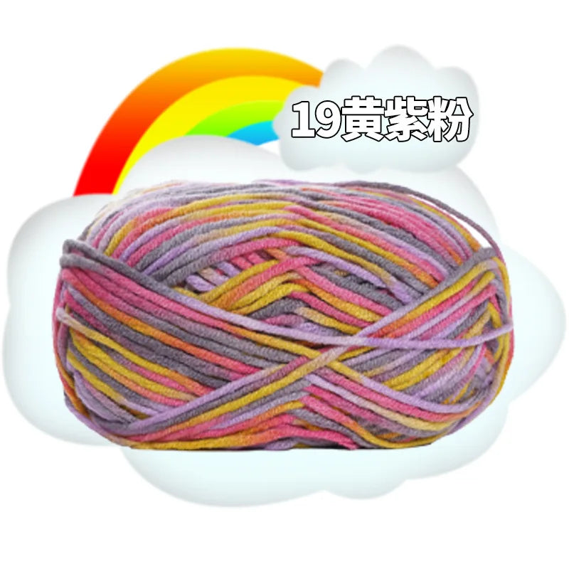 A ball of multi-colored yarn, featuring pink, yellow, and purple threads, is shown emerging from a cloud under a rainbow.