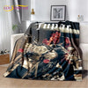 A dark graphic throw blanket featuring a vintage-inspired portrait of Tupac Shakur.