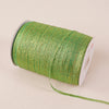 A roll of 10-meter gold and silver glitter satin ribbon with a white core.