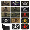 A collection of embroidered skull and sword patches in various camouflage and solid colors for tactical gear.