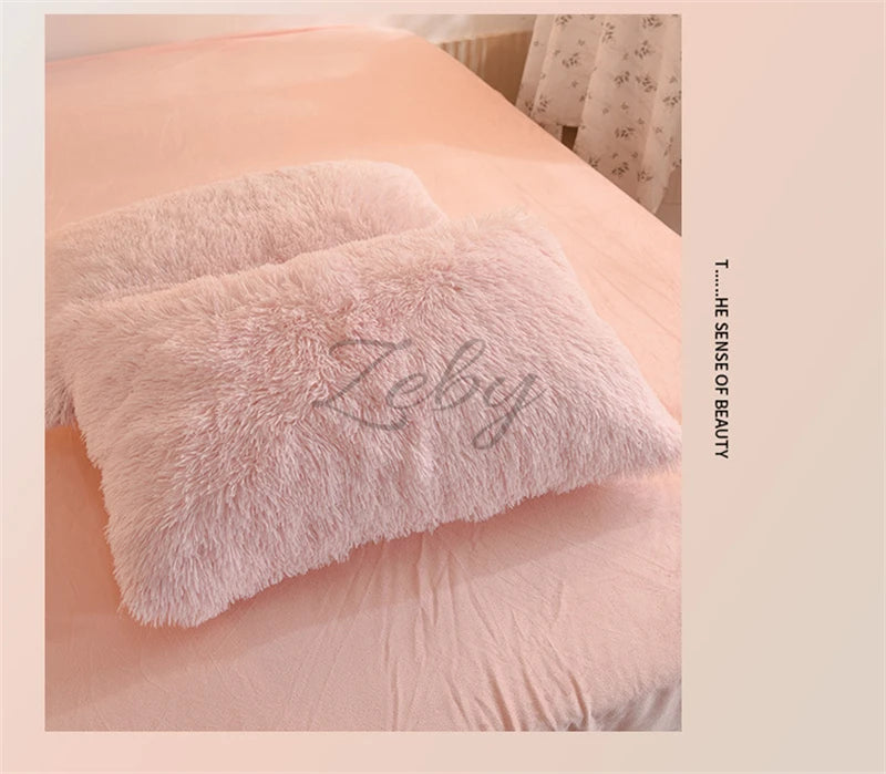 A fluffy pink faux fur pillow resting on a light pink duvet cover.