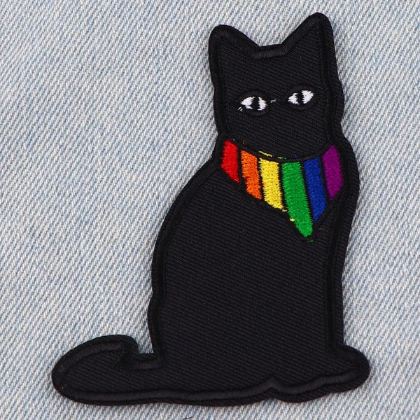 Black embroidered cat iron-on patch with a rainbow colored collar