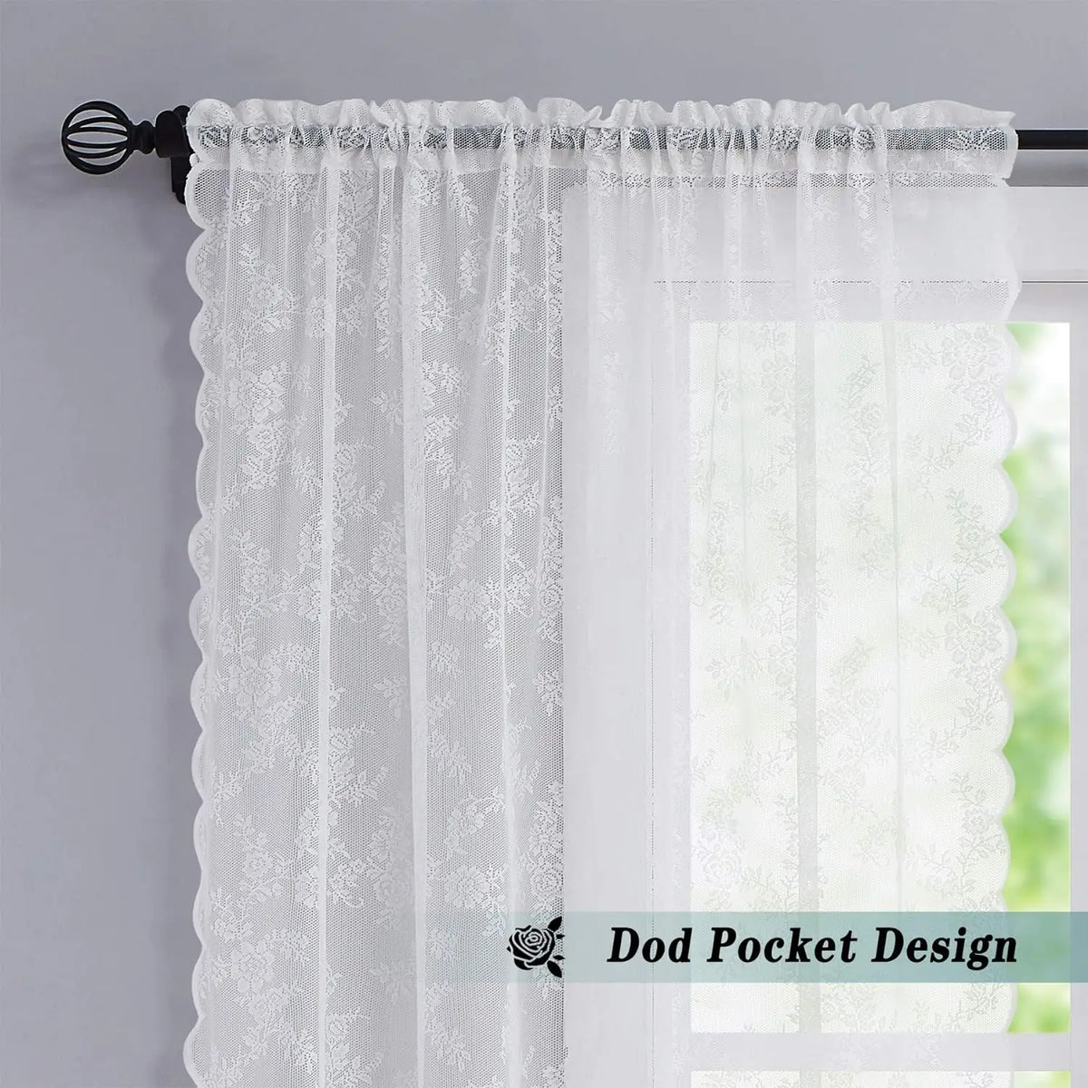 White vintage floral lace curtain panel hanging on a rod