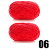 A ball of bright red thick velvet yarn used for knitting and crochet projects.