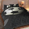 A soccer ball themed duvet cover set with three pillowcases featuring a large graphic of a soccer ball on a dark background.
