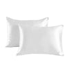 A pair of smooth white satin pillowcases lying flat.