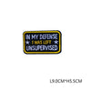 Black embroidered patch with yellow text reading In My Defense I Was Left Unsupervised