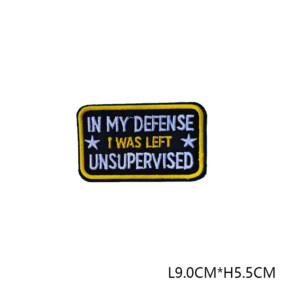Black embroidered patch with yellow text reading In My Defense I Was Left Unsupervised