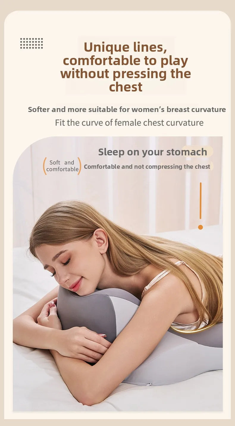A woman is lying down comfortably on a pillow designed to support the chest curve.
