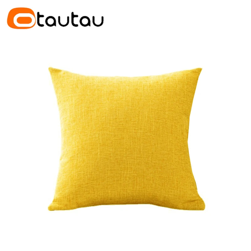 A bright yellow cushion cover made of soft cotton linen with a button closure.