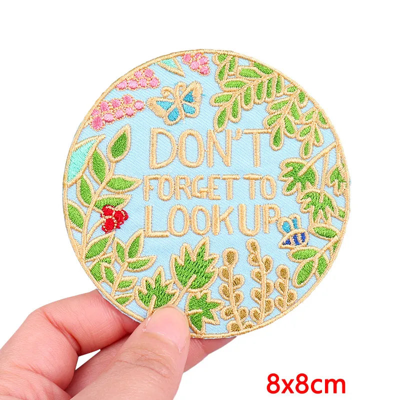Light blue embroidered patch featuring a butterfly and leaves with the text DON'T FORGET TO LOOK UP