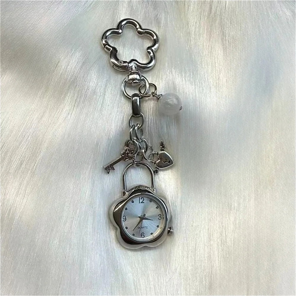 Silver pocket watch keychain featuring an adjustable clock mechanism attached to a decorative loop.