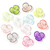 A collection of colorful resin flower bead caps in shades of green, pink, yellow, and purple for jewelry making.