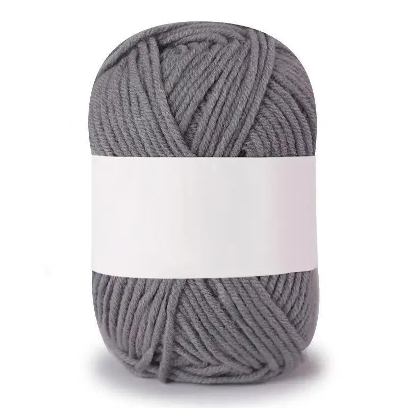 A ball of gray soft milk cotton knitting yarn