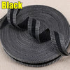 Roll of black iron-on hem tape for pants and jeans