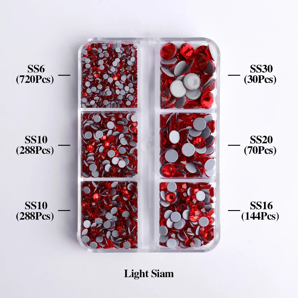 A clear plastic container holds various sizes of red and silver glass rhinestones categorized by SS6, SS10, SS10, SS30, SS20,