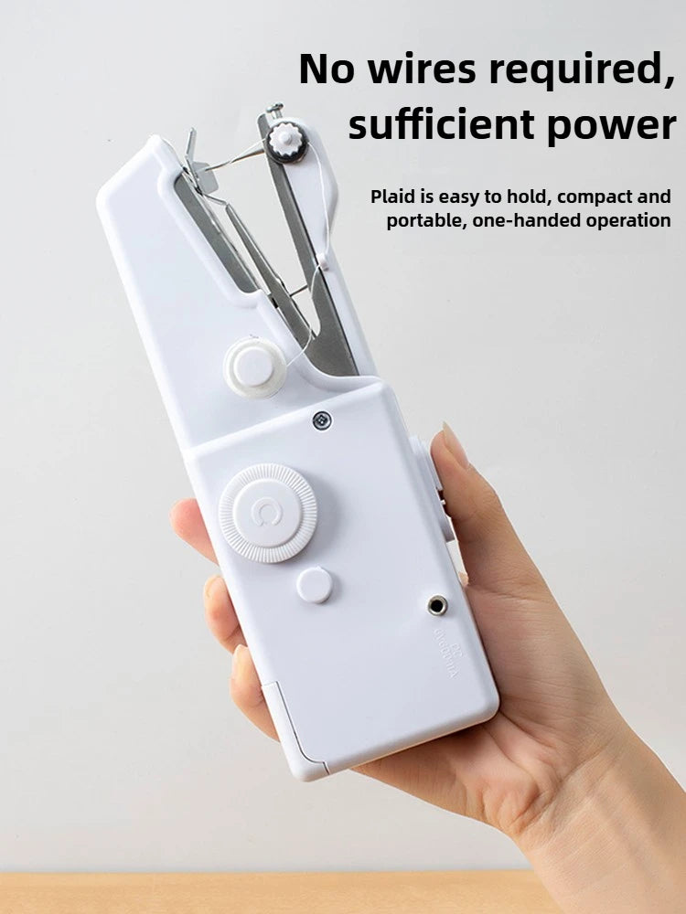 A hand is holding a white portable mini hand sewing machine with pliers and a needle visible.