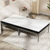 A white tri-fold memory foam mattress lying on a light wood floor with a patterned rug.