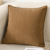 A brown luxury chenille throw pillow cover resting on a light-colored sofa.