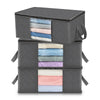 A stack of three dark gray foldable storage boxes, each containing neatly folded fabric items in various pastel colors.