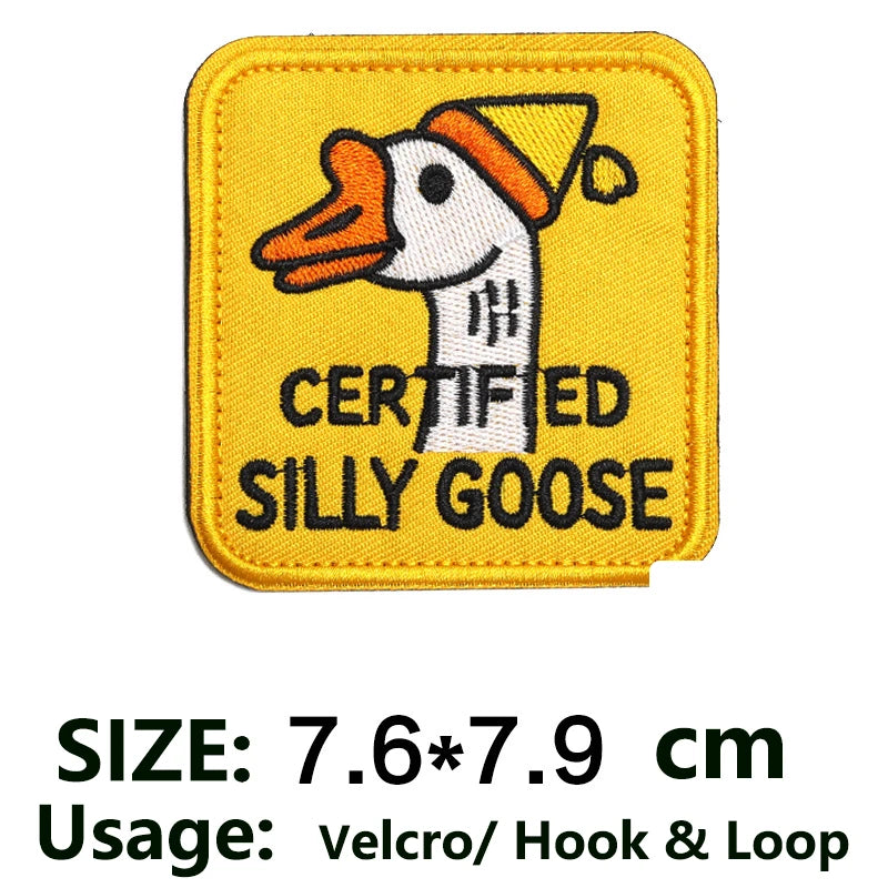 Yellow embroidered patch featuring a cartoon goose wearing an orange hat, labeled Certified Silly Goose.
