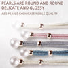 A collection of round artificial pearl curtain tie-backs in various colors including white, pink, silver, and blue.