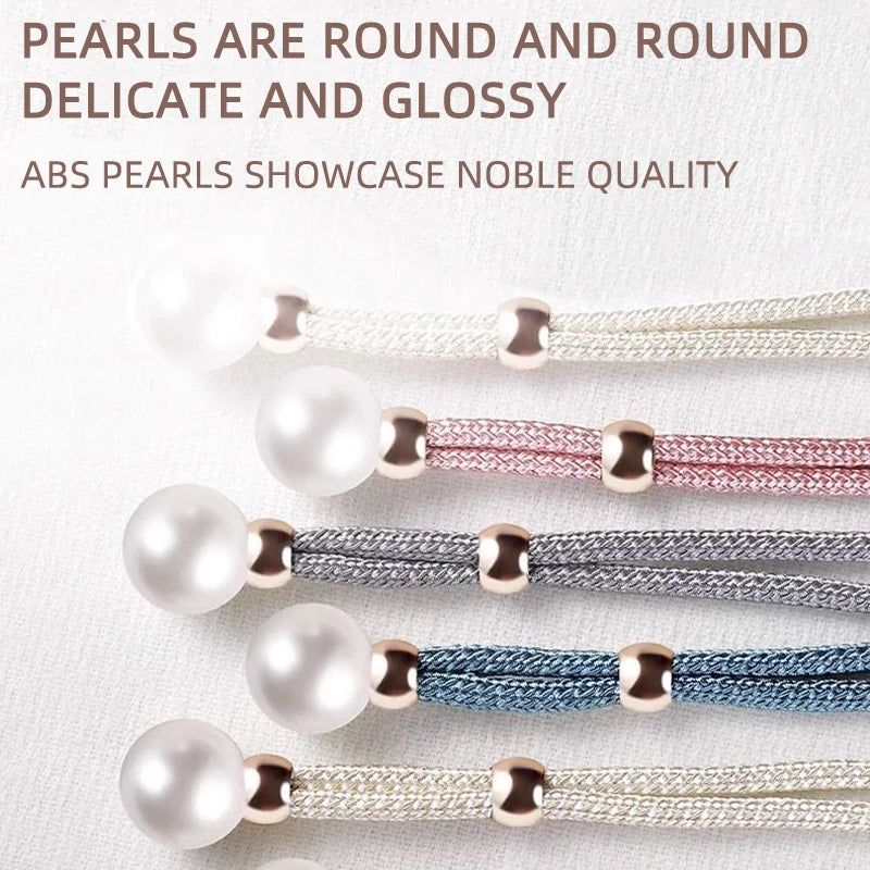 A collection of round artificial pearl curtain tie-backs in various colors including white, pink, silver, and blue.