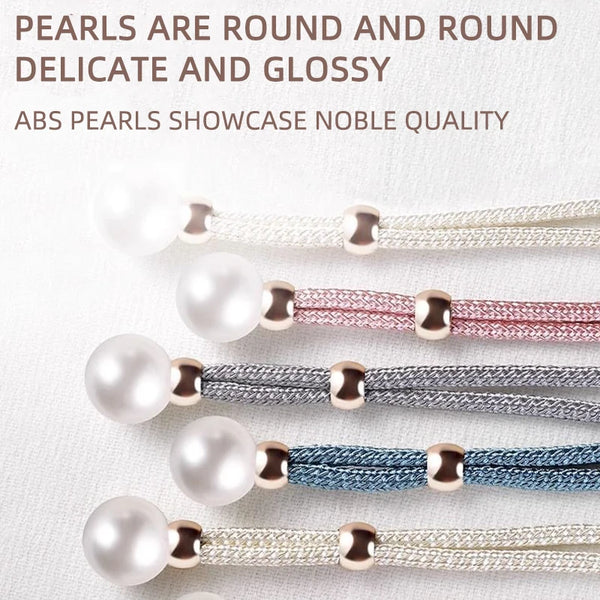 A collection of round artificial pearl curtain tie-backs in various colors including white, pink, silver, and blue.