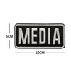 Black embroidered patch with the word MEDIA in light gray text and a hook and loop backing.