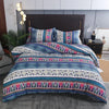 Boho geometric duvet cover set featuring blue, purple, and white patterns on a bed.