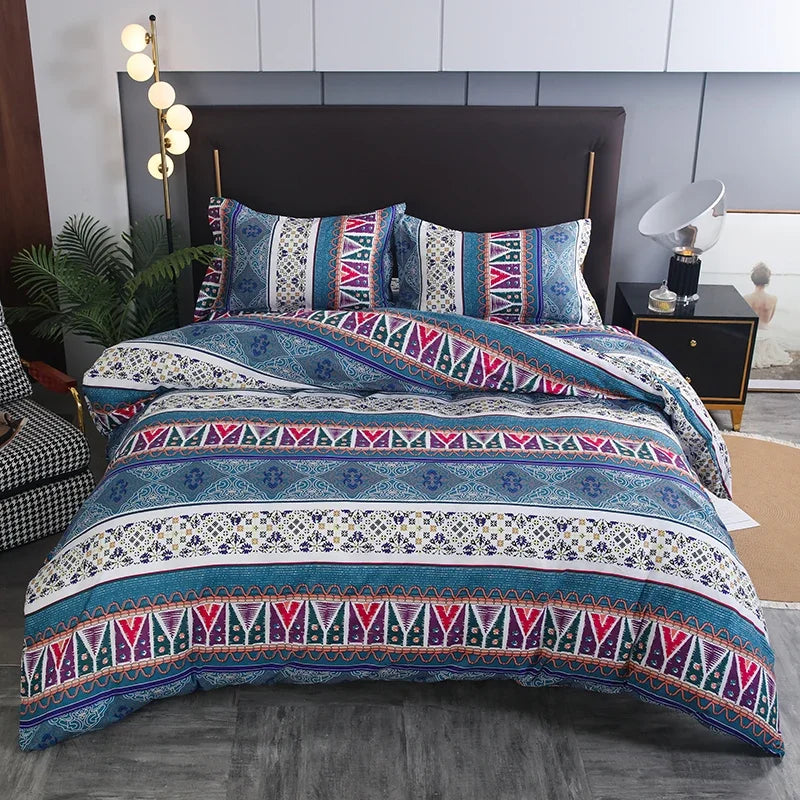 Boho geometric duvet cover set featuring blue, purple, and white patterns on a bed.