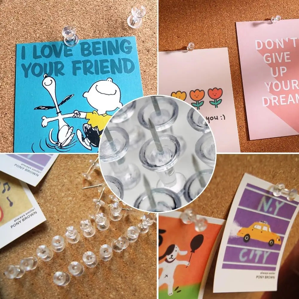 A collection of clear plastic push pins with steel tips pinned to colorful cards and a string of similar pins.