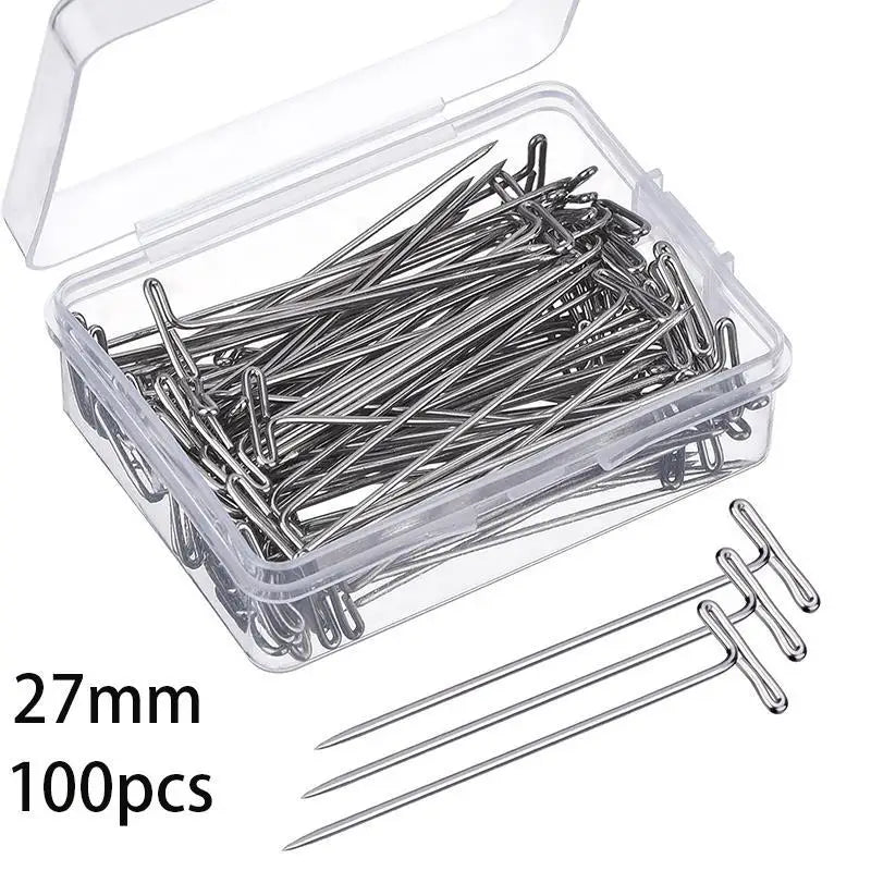 A clear plastic box containing 100 stainless steel T-pins for knitting blocking and sewing.