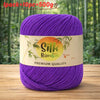 Purple silk bamboo blend yarn skein with a label indicating premium quality