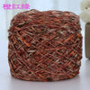 A ball of reddish-brown metallic silk yarn used for crocheting and knitting.