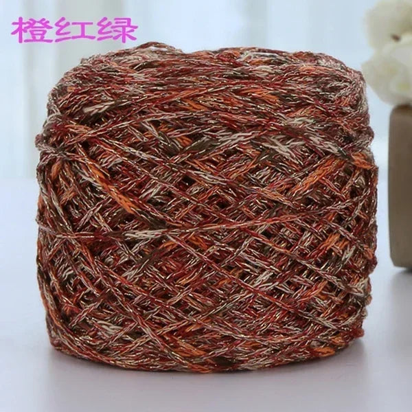 A ball of reddish-brown metallic silk yarn used for crocheting and knitting.