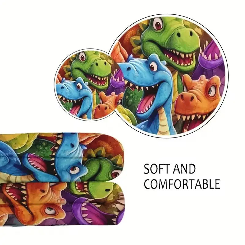 A colorful print of various dinosaurs on a flannel throw blanket.