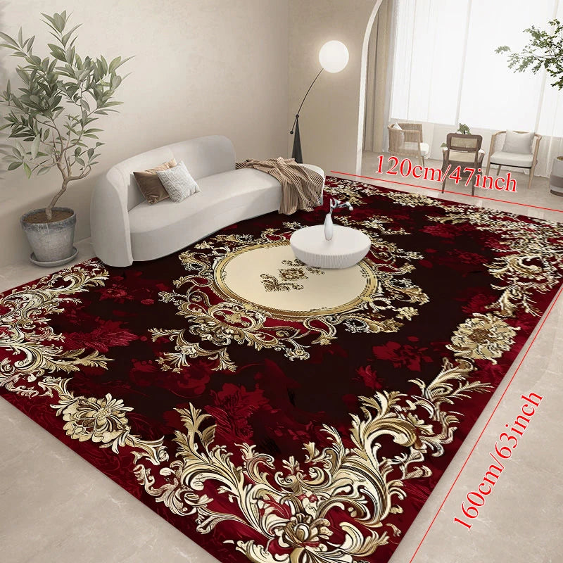 A luxurious deep red area rug featuring intricate gold floral patterns and a central white decorative tray.