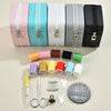 A collection of colorful leather sewing boxes and a complete hand sewing kit including needles and scissors.
