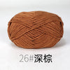 A ball of brown organic cotton 4ply knitting yarn with a diagonal weave pattern.