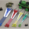 A set of bias tape makers showing numbered tapes in blue, red, yellow, and green against a light background.