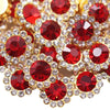 Close-up of sunflower crystal rhinestone sew-on buttons in red and clear stones.