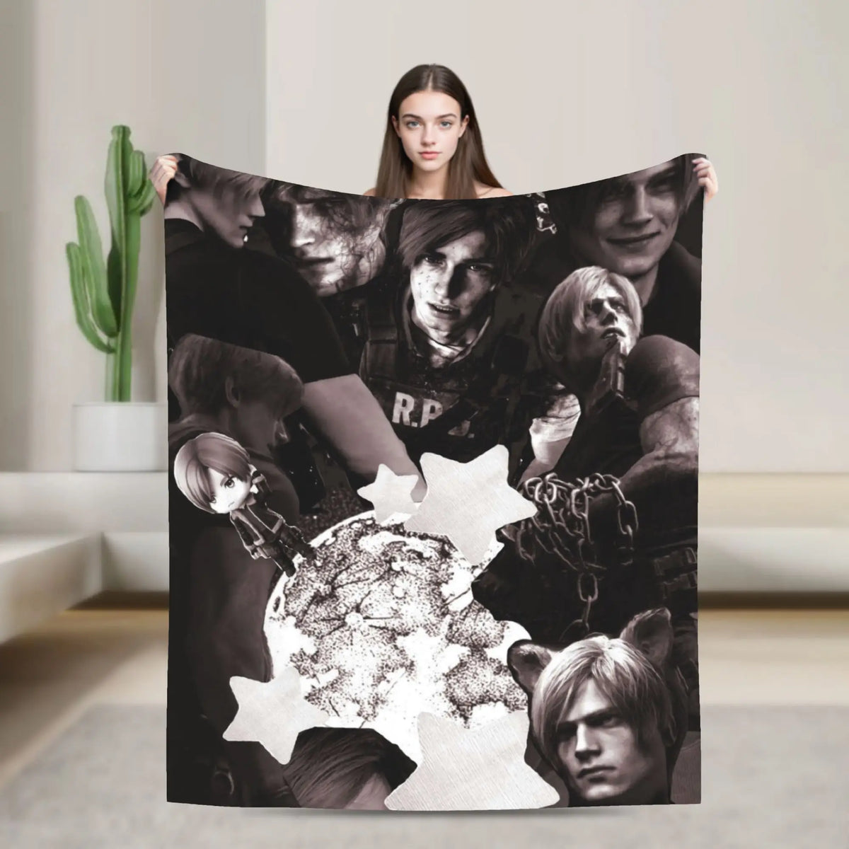 A black graphic throw blanket featuring multiple faces of characters from a movie, held up by a woman.
