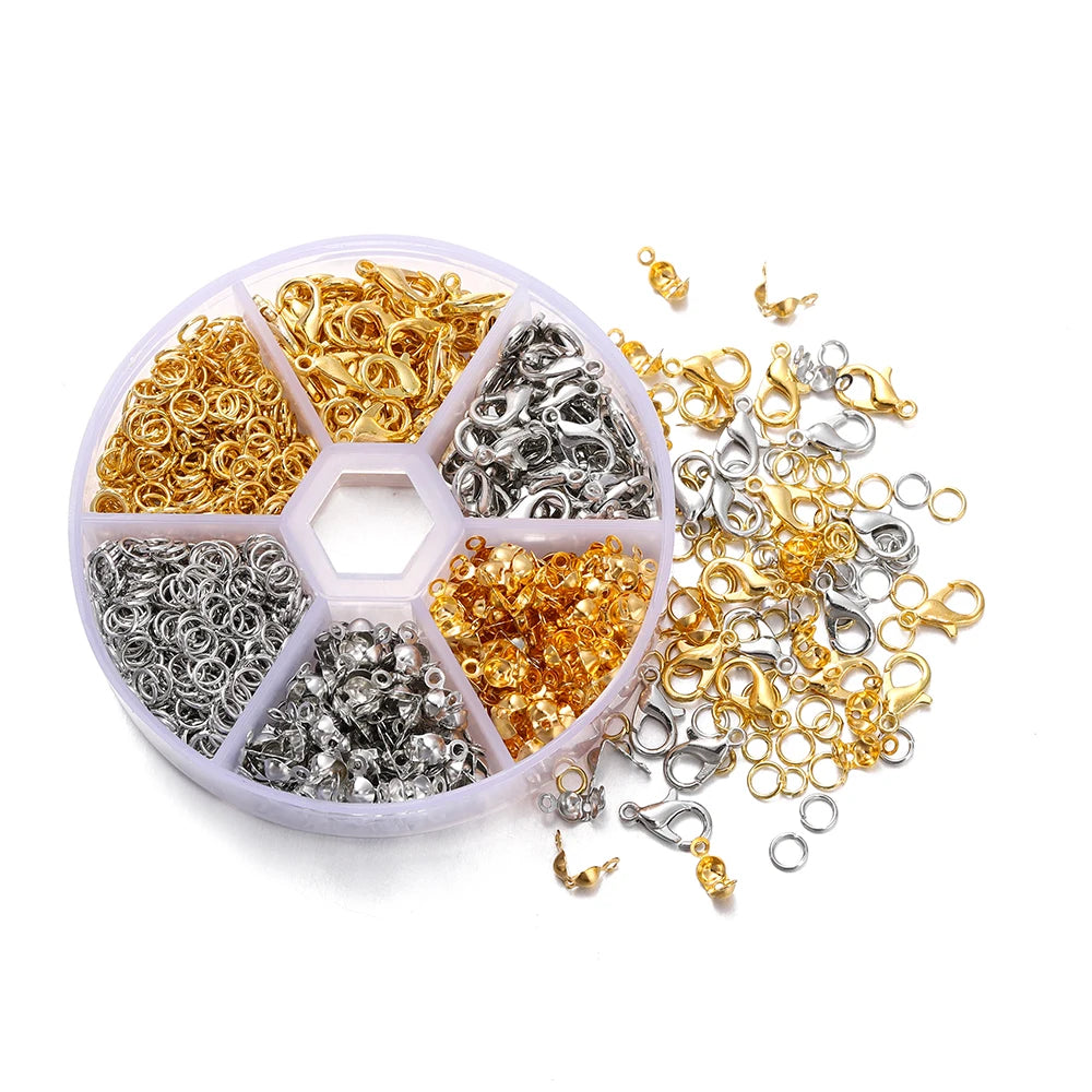 A clear plastic container filled with various gold and silver lobster clasp findings for jewelry making.