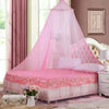 Pink mesh mosquito net draped over a bed for home decor