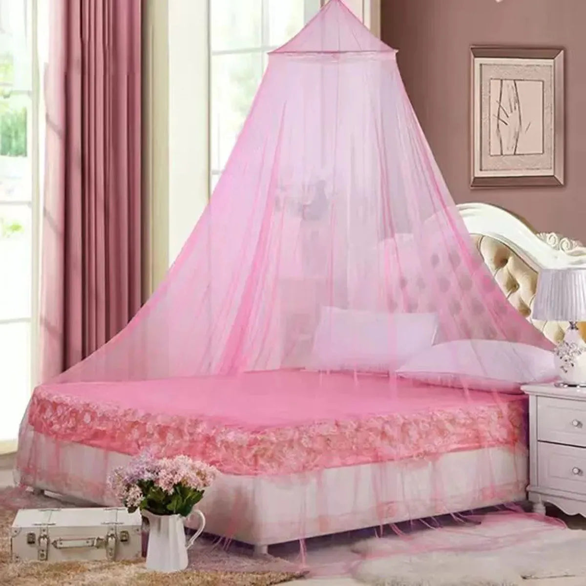 Pink mesh mosquito net draped over a bed for home decor