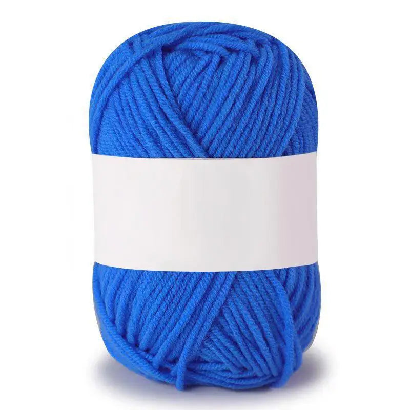 A ball of bright blue soft milk cotton knitting yarn